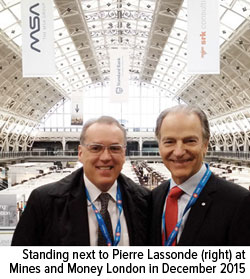 Frank Holmes standing next to Pierre Lassonde right at Mines and Money London in December 2015