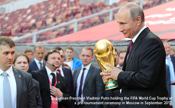 Russian president Vladimir Putin holding the FIFA world cup trophy at a pre tournament ceremony in Moscover in September 2017